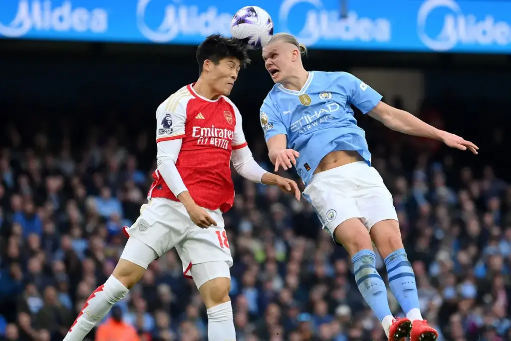 City's Haaland in an arial battle with Arsenal's Tomiyasu