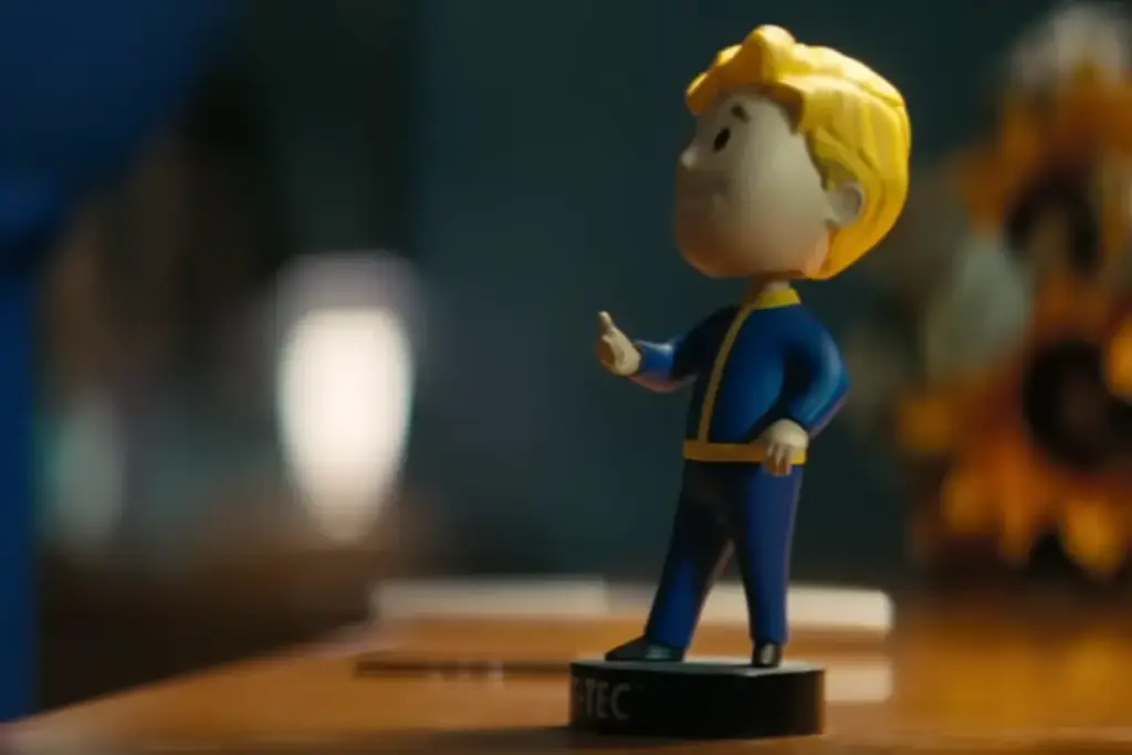 Still of the Vault Boy Bobble head from the Fallout series on Amazon Prime.