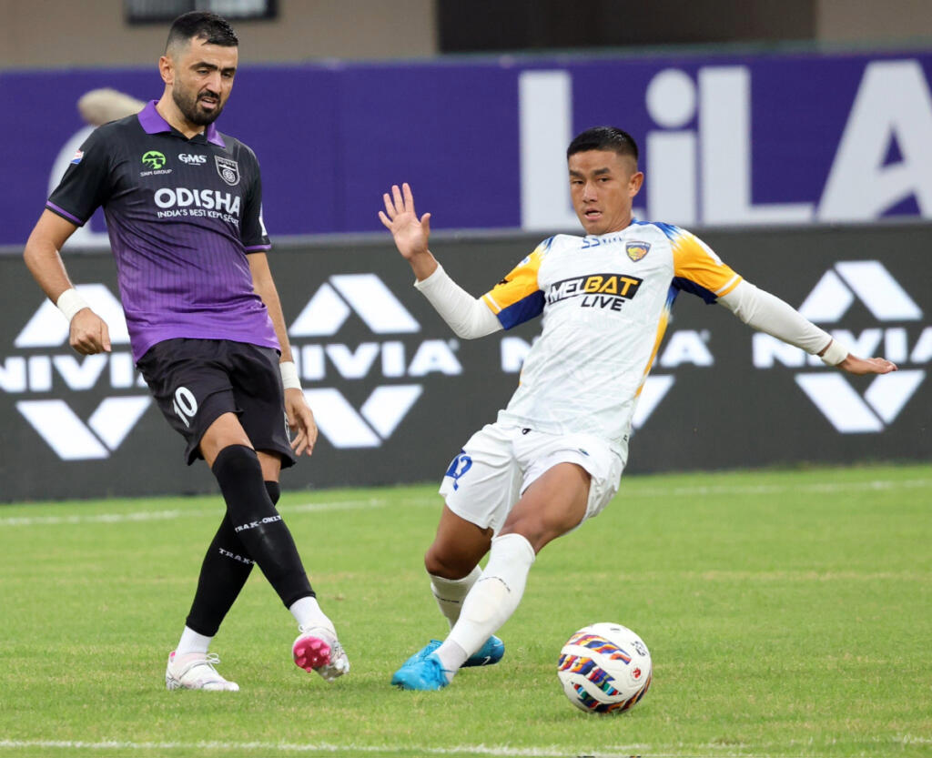 Odisha FC's Janouh pushing one past Chennaiyin FC's Hnamte