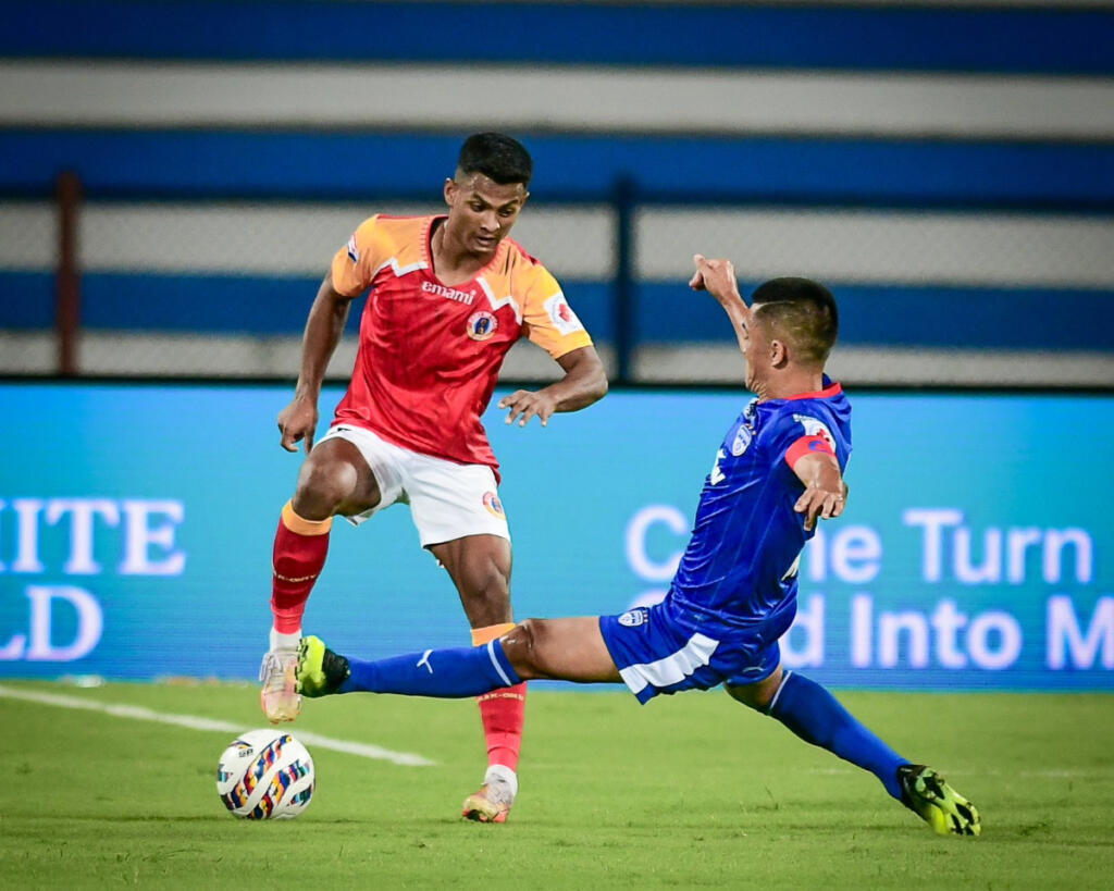 East Bengal's M. Rakip keeping the ball safe against Bengaluru FC at the Sree Kanteerava Stadium.