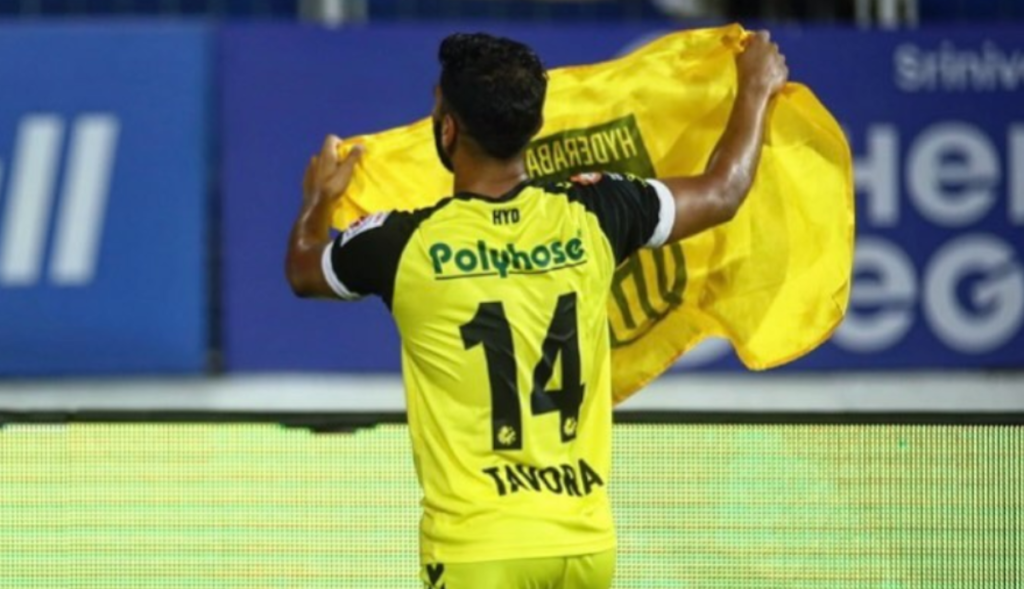 Sahil with the Hyderabad FC flag.