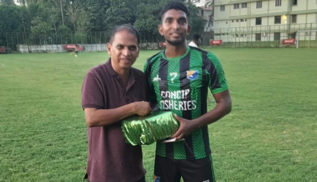 Ambelim FC's Nial Cardozo receiving the MoM award.