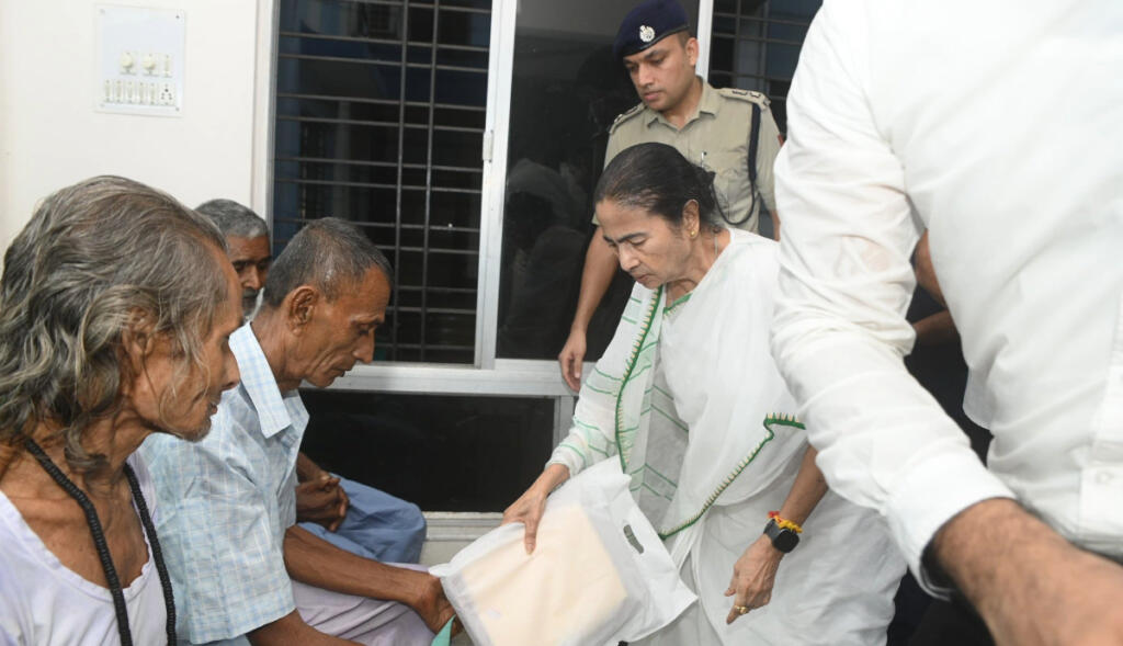 Mamata Bannerjee distributing relief materials in Barjora