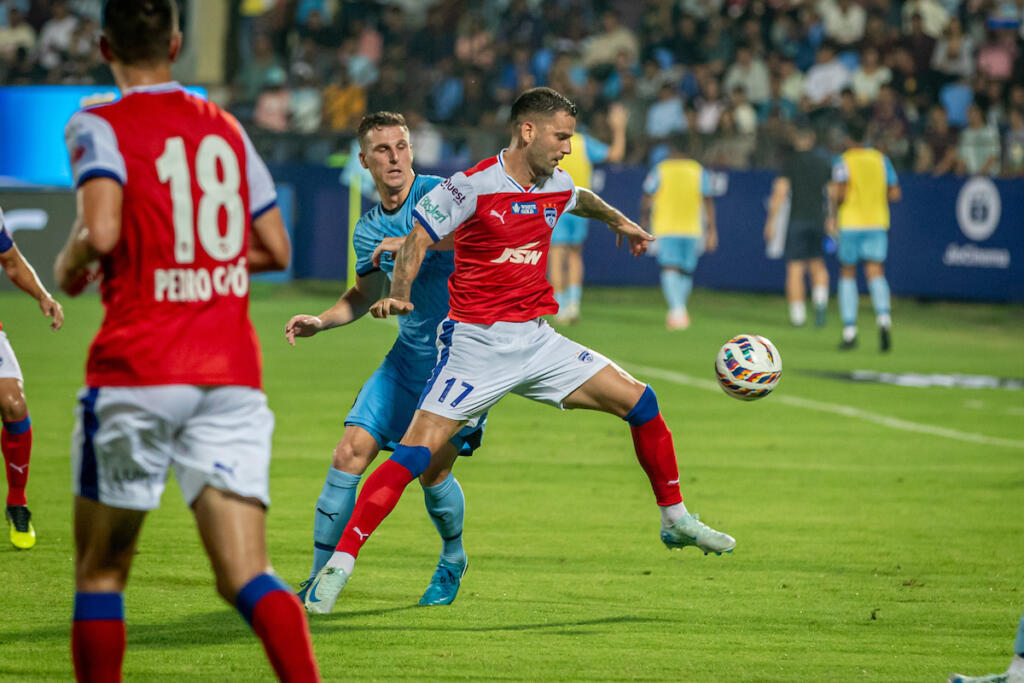 BFC's Edgar Mendez with the ball against MCFC's Yoell Van Nieff