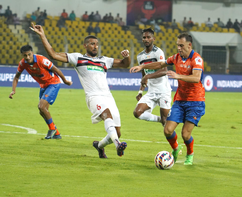 FC Goa's Dejan Drazic and NEUFC's Mohammed Ali Bemammer in action