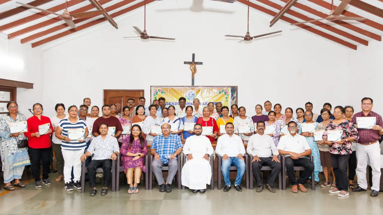 Participants holding completion certificates pose with organisers and resource persons after the Roman Konkani Orthography Workshop at St. Jerome's Church Hall in Mapusa.