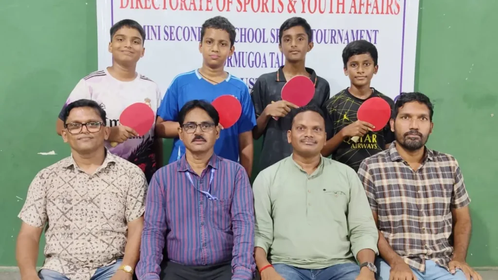 Players of Regina Mundi High School, Chicalim, with tournament officials after winning the Mormugao Taluka Cluster 11 Level U-14 Boys Table Tennis Tournament 2026–27 at Chicalim Sports Complex.