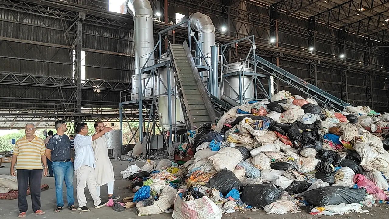 Congress delegation inspecting the Sonsodo gasification plant in Margao, with piles of waste near the processing unit, during a visit alleging the plant is running below capacity.